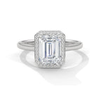 Top front view of a 4 CT emerald cut lab-grown diamond engagement ring with micro-pave halo border in 14K white gold.
