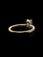 Under-gallery perspective of a yellow gold emerald cut lab diamond ring featuring a hidden halo collar and smooth interior band.