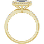 Direct side profile view showing the elevated setting and cathedral bridge of a 3 CT East-West emerald cut ring in yellow gold.