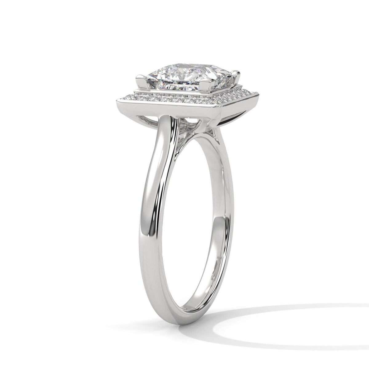Angled side view of a 3 CT princess cut lab-grown diamond engagement ring with a micro-pave frame halo in 14K white gold.