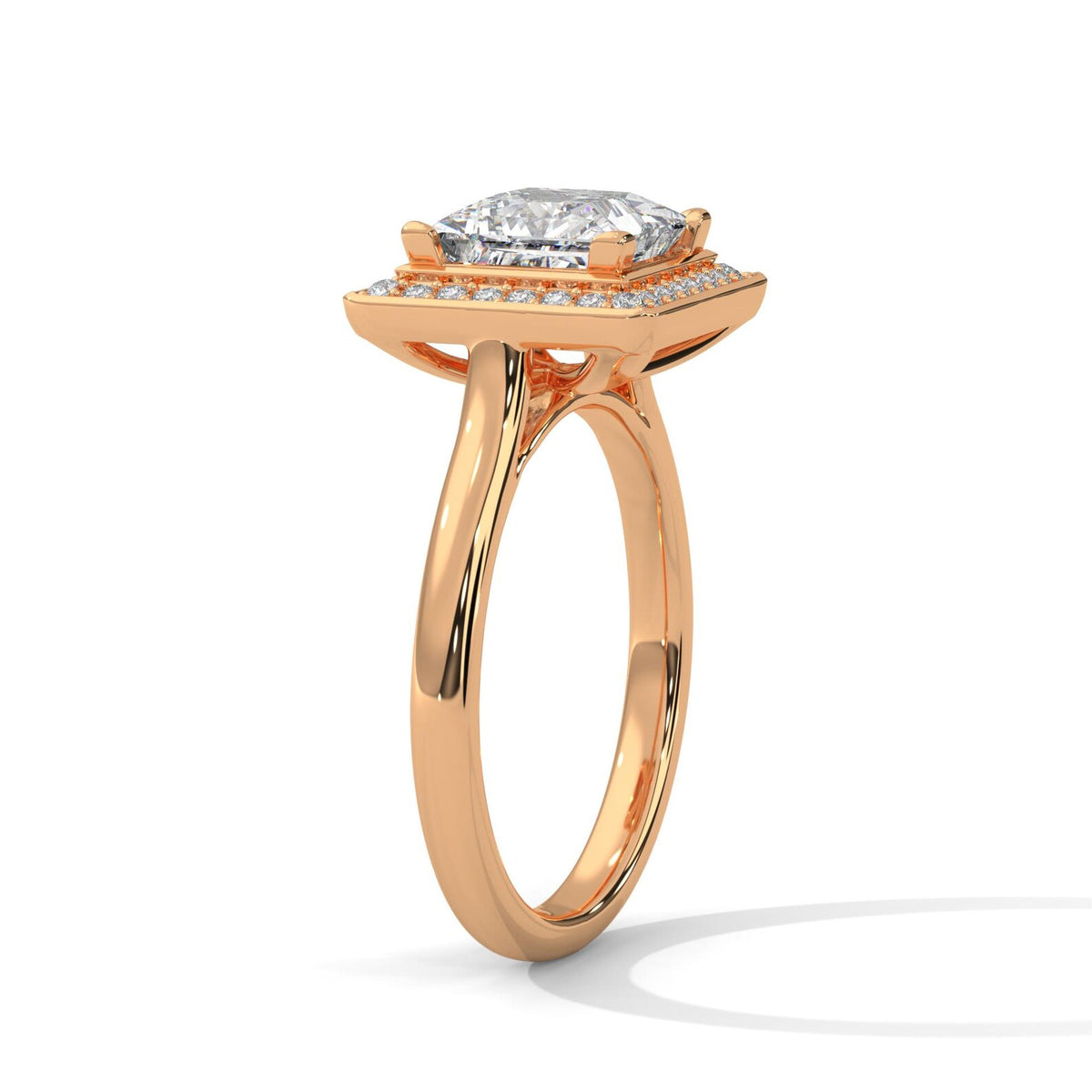 Angled side profile view of a 3 carat princess cut lab diamond engagement ring with cathedral gallery in 14K rose gold.