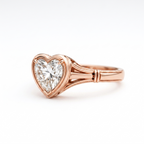 Side angle view of a 2 CT heart lab diamond ring featuring a framed bezel setting and split shank in 14K rose gold.