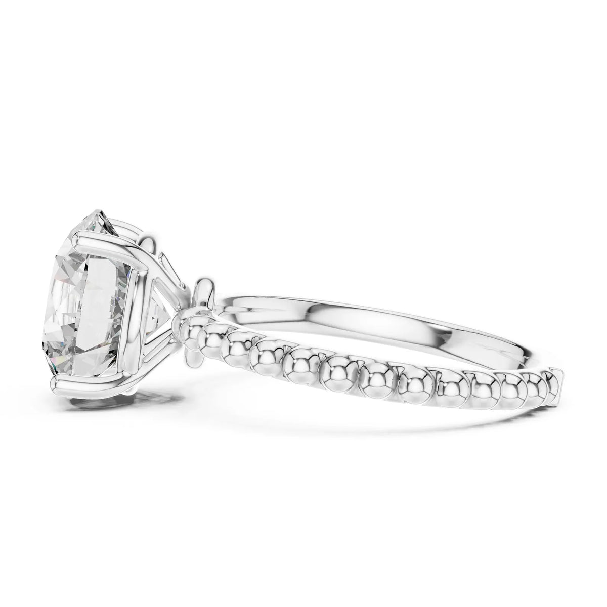 Side profile view of a 3 CT round lab-grown diamond engagement ring with a beaded band in 14K white gold.