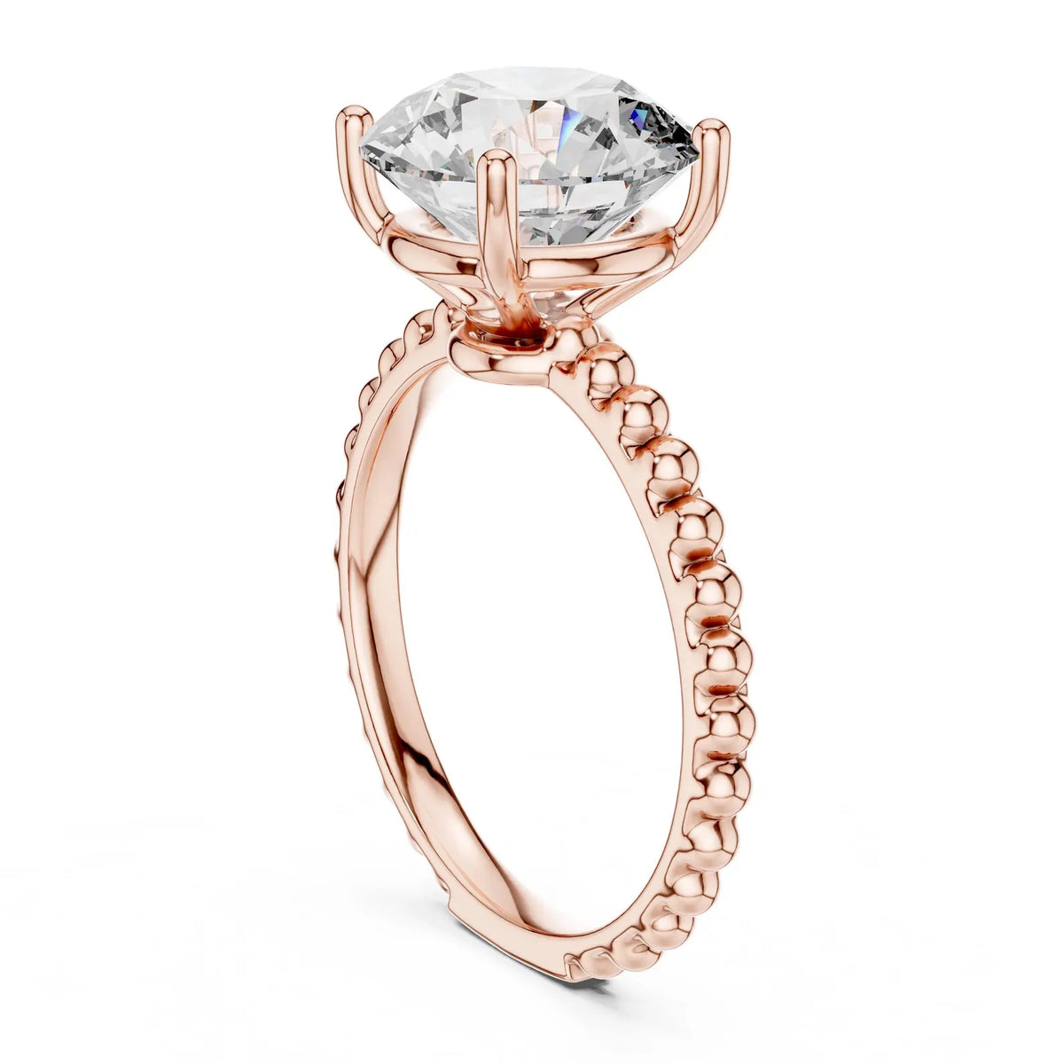 Low vertical angle view showing the basket head and beaded band of a 3 CT round lab diamond ring in rose gold.