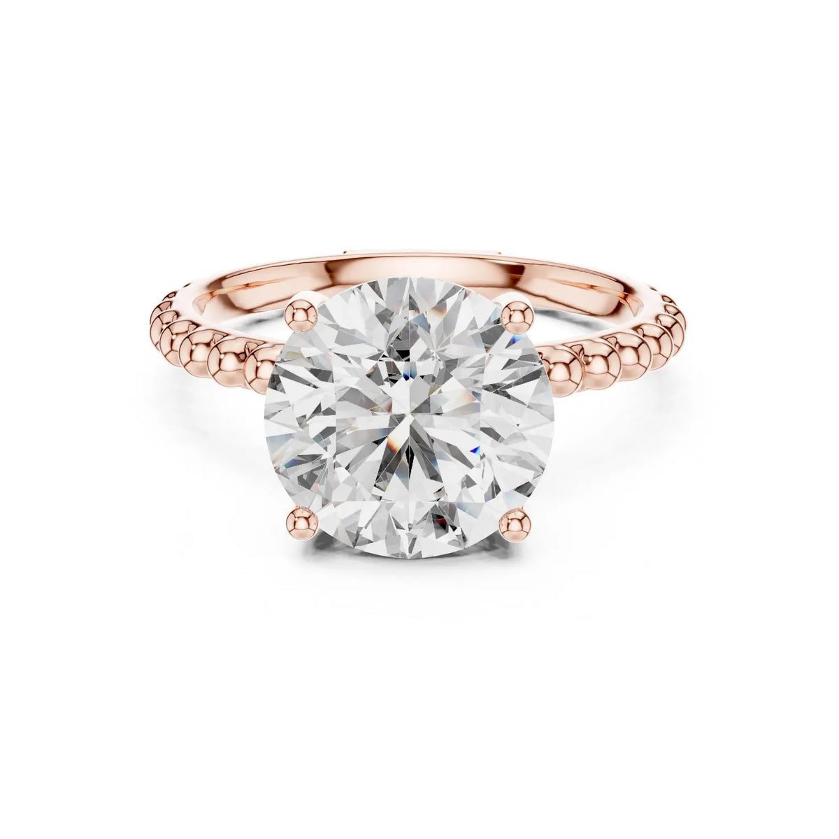 Front top view of a 3 CT round lab diamond engagement ring with a beaded band setting in 14K rose gold.