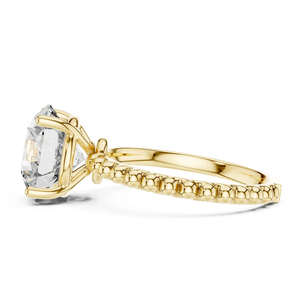 Side view profile of a 3 CT round lab-grown diamond ring showing basket head and beaded shank in 14K yellow gold.