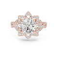 Top-down view showing the 8-pointed floral halo frame surrounding a 3 CT round lab diamond in rose gold.