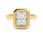 Direct top view of a 3 CT radiant cut lab-grown diamond in a yellow gold milgrain bezel setting.