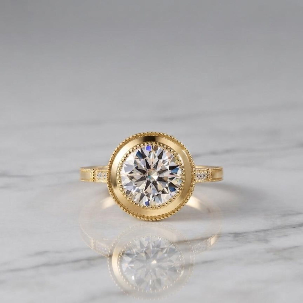 3 CT round lab grown diamond vintage bezel ring in yellow gold resting on a white marble surface displaying center stone reflections.