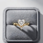 Front view of a 2 CT heart lab grown diamond wishbone ring displayed inside a plush gray velvet ring box.