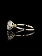 Profile view of an IGI certified 2 carat round lab diamond solitaire showing the sparkling hidden halo collar under the center stone.