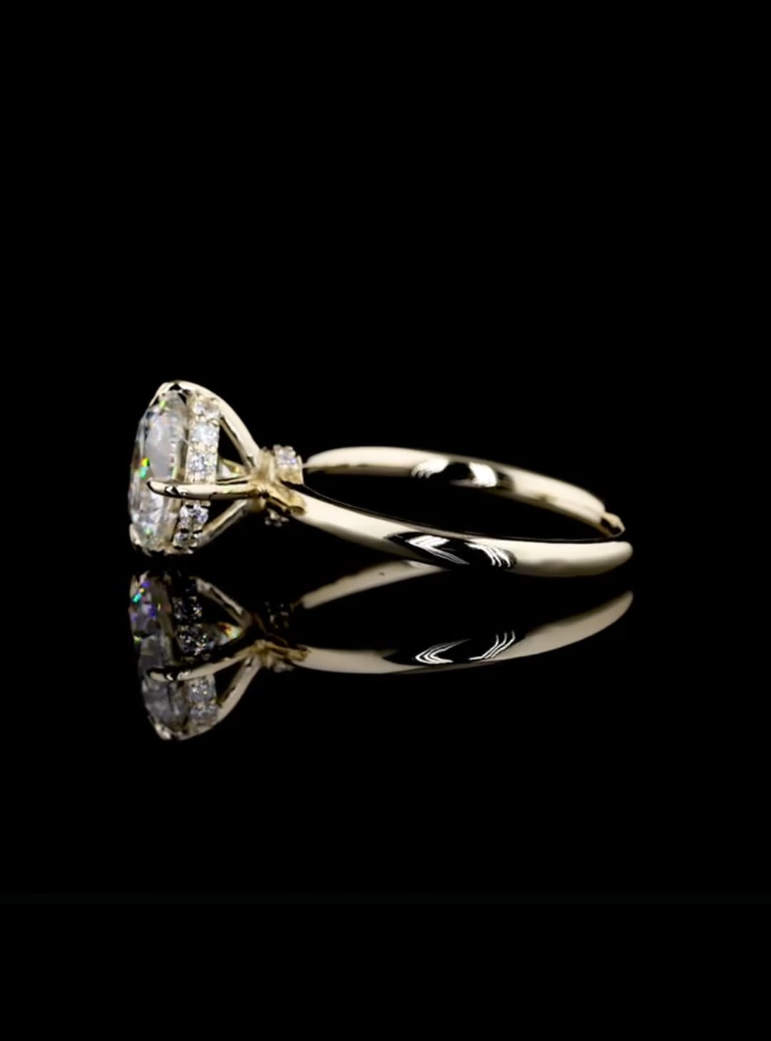 Profile view of an IGI certified 2 carat round lab diamond solitaire showing the sparkling hidden halo collar under the center stone.