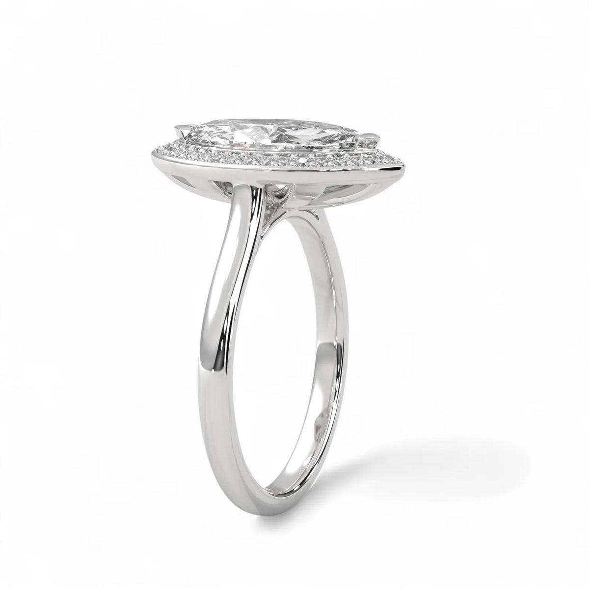 Angled side view of a 4 carat marquise lab diamond ring in white gold showing elevated micro-pavé halo setting.
