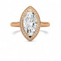 Top-down view of a 4 CT marquise lab grown diamond engagement ring with micro-pavé halo in rose gold.