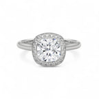Top-down view of a 3 CT cushion cut lab grown diamond halo engagement ring in white gold.