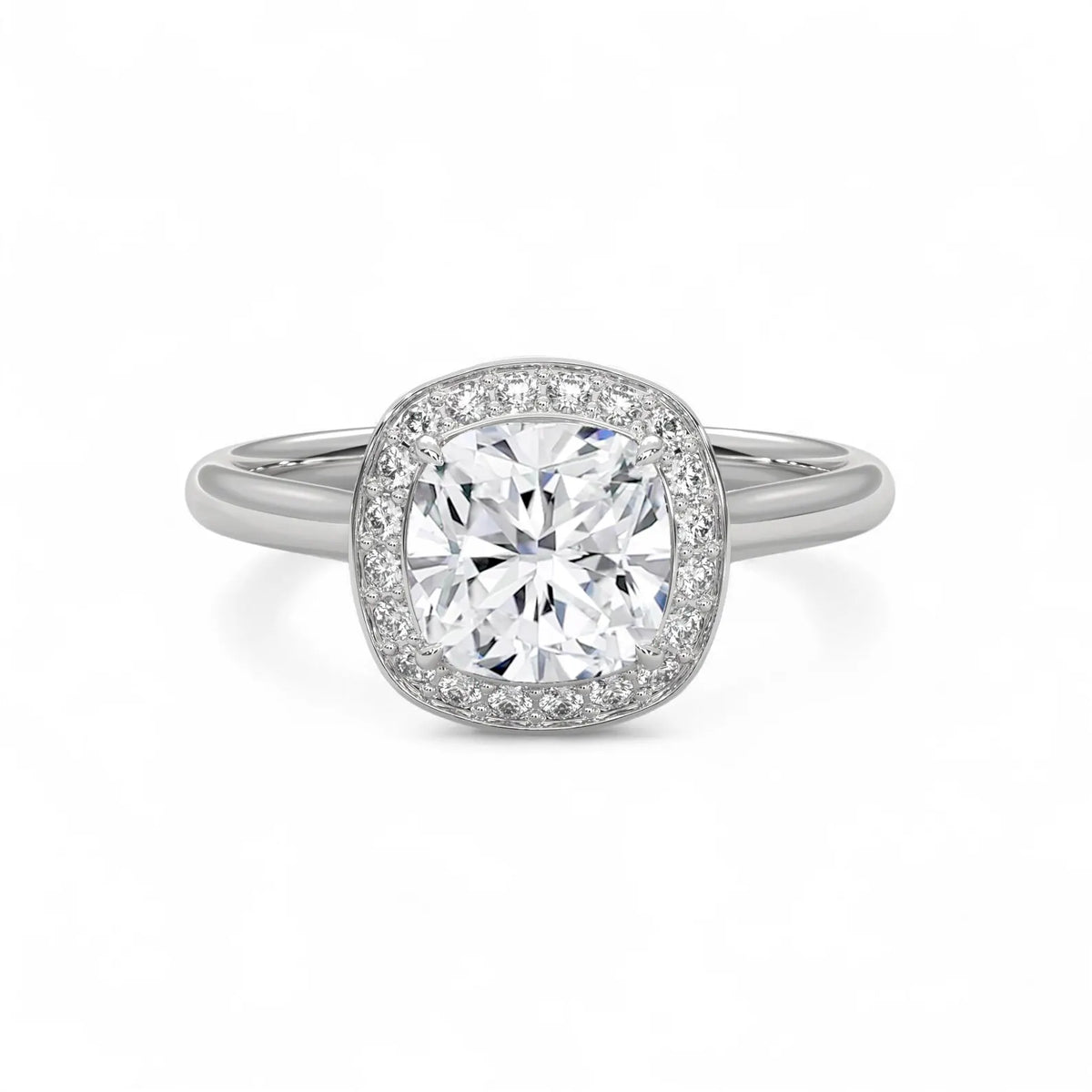 Top-down view of a 3 CT cushion cut lab grown diamond halo engagement ring in white gold.
