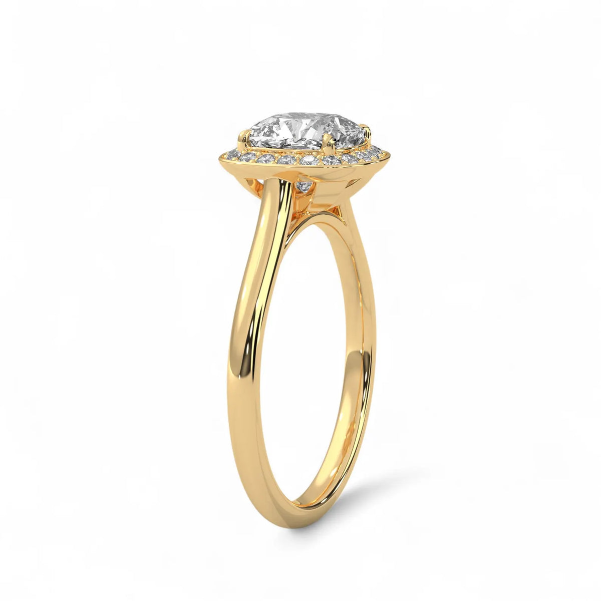 Angled side view of a 3 CT cushion cut lab grown diamond halo engagement ring in 14k yellow gold.