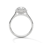 Side profile view of a white gold 3 CT cushion cut lab grown diamond halo ring featuring a cathedral setting and pavé band.