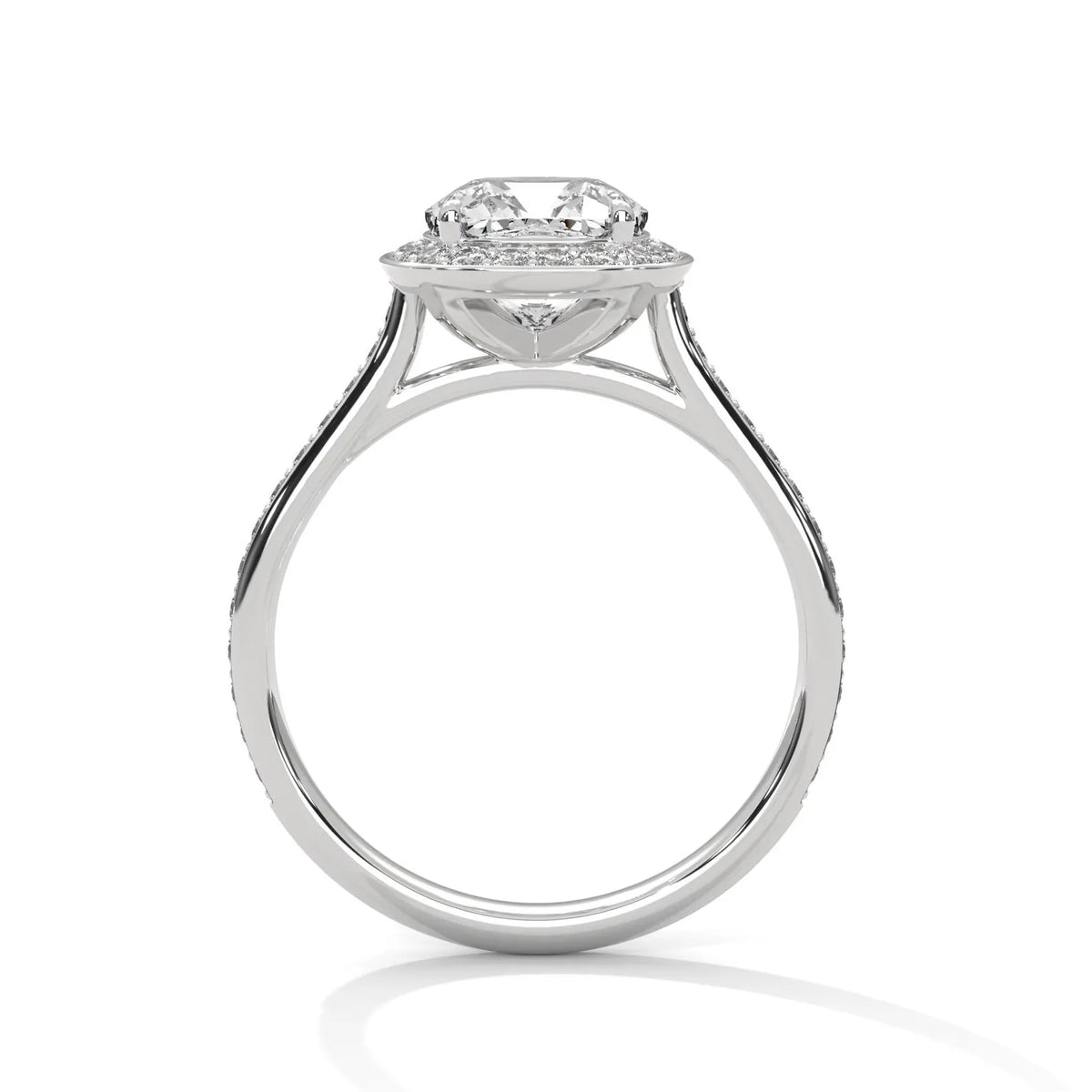 Side profile view of a white gold 3 CT cushion cut lab grown diamond halo ring featuring a cathedral setting and pavé band.