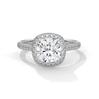 Top-down view of a 3 CT cushion cut lab grown diamond halo engagement ring in white gold with pavé diamond band.