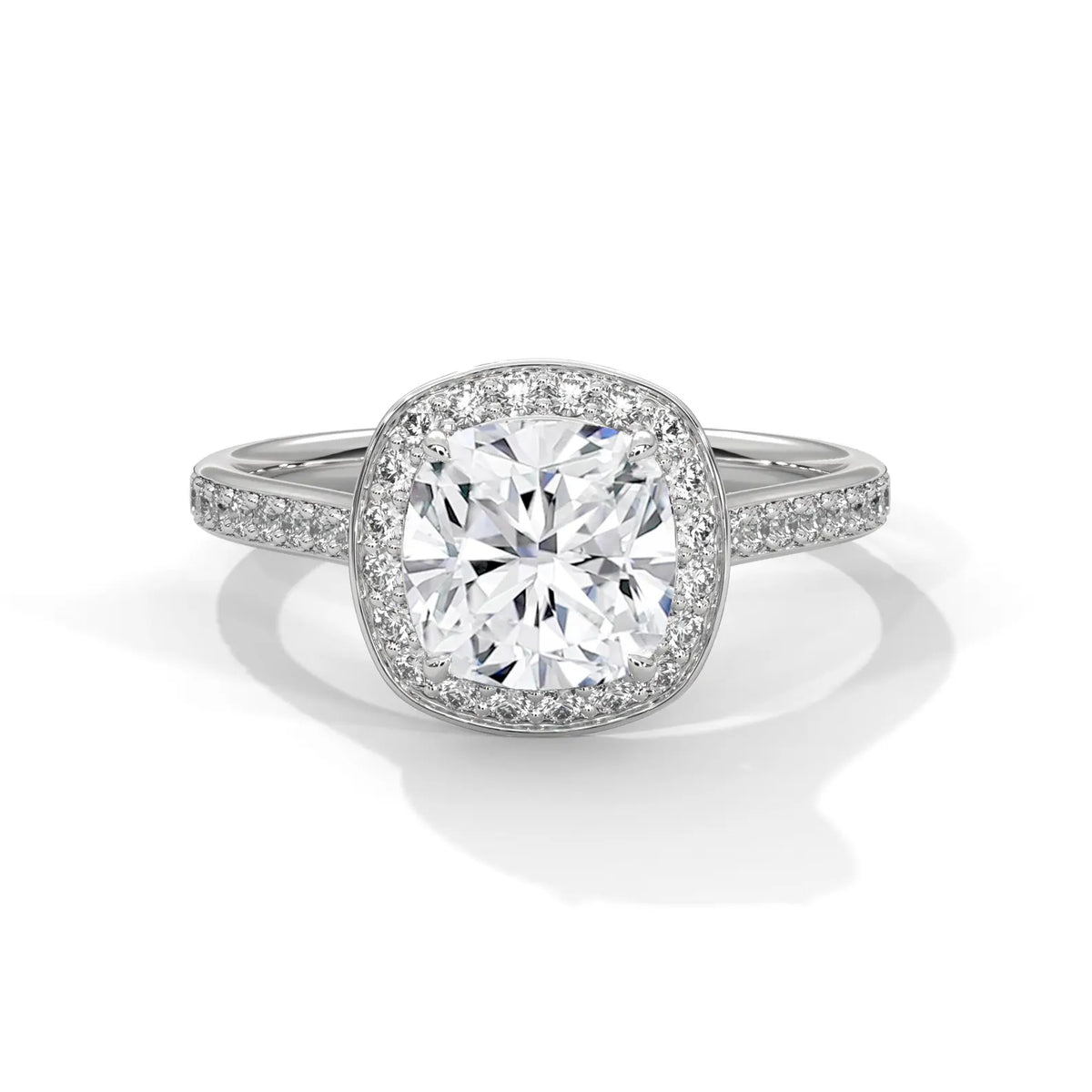 Top-down view of a 3 CT cushion cut lab grown diamond halo engagement ring in white gold with pavé diamond band.