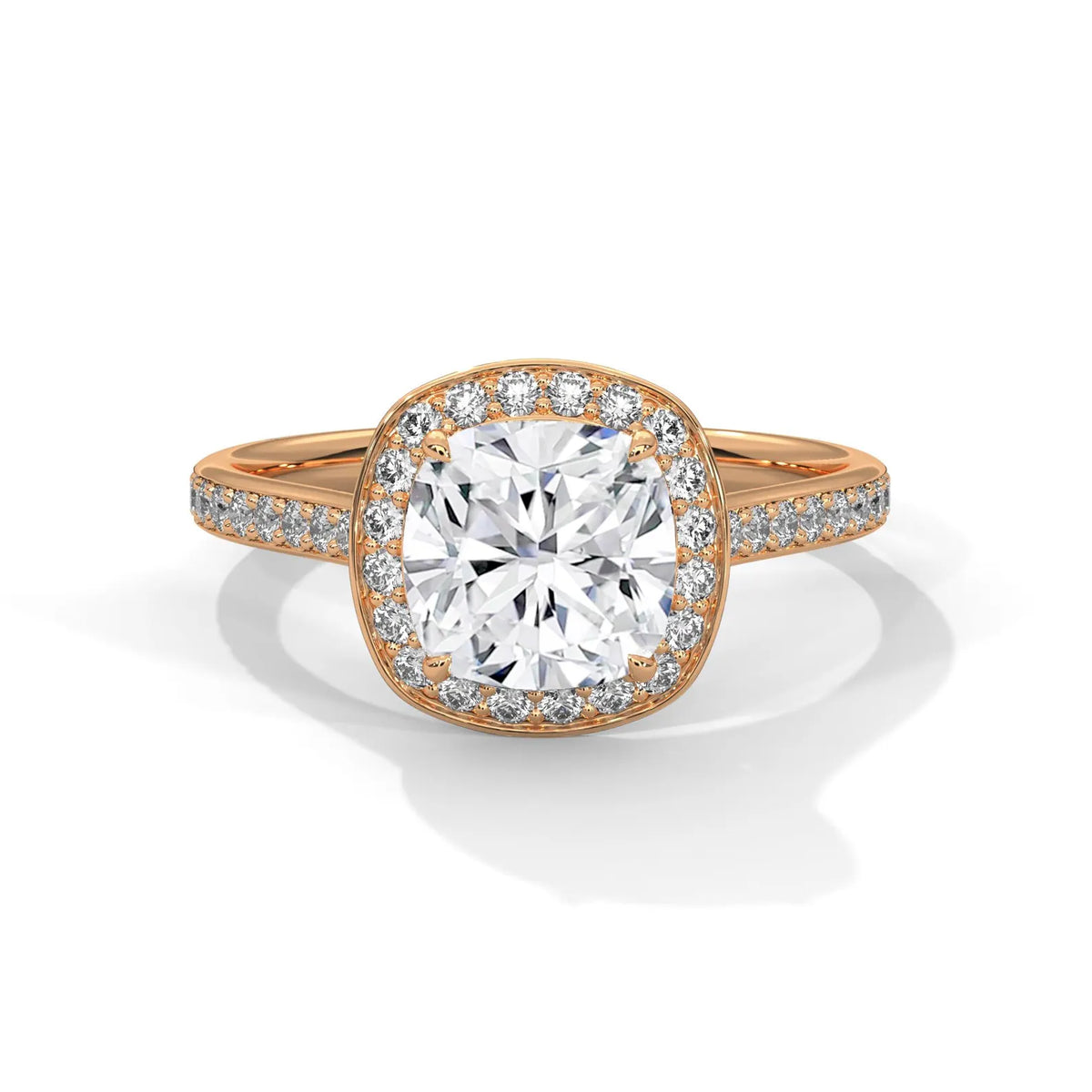 Top-down view of a 3 CT cushion cut lab grown diamond engagement ring with micro-pavé halo and pavé band in rose gold.