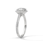Angled side view of a white gold 3 CT cushion cut lab diamond engagement ring showing cathedral setting and pavé band.