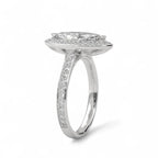 Angled side view of a white gold 4 CT marquise cut lab diamond halo engagement ring showcasing pavé band.