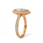 Angled side view of a 4 carat marquise cut lab diamond engagement ring with halo and pavé band in rose gold.