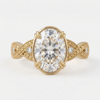 Top-down view of a yellow gold 4 CT oval cut lab grown diamond ring featuring a botanical hand-engraved shank.