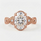 Top-down view of a rose gold 4 CT oval cut lab grown diamond ring with vintage engraved twisted band.