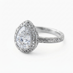 Angled perspective view of a white gold 3 CT pear lab diamond engagement ring with intricate scrollwork halo and milgrain band.