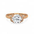Overhead front view of a 3 CT round brilliant lab grown diamond engagement ring set in romantic rose gold.