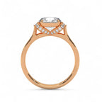 Side profile view of a rose gold 3 carat round cut lab diamond ring showing the arching pave diamond hidden halo basket.