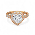 Top-down view of a 3 CT heart-cut lab grown diamond ring with a halo setting and pavé band in rose gold.