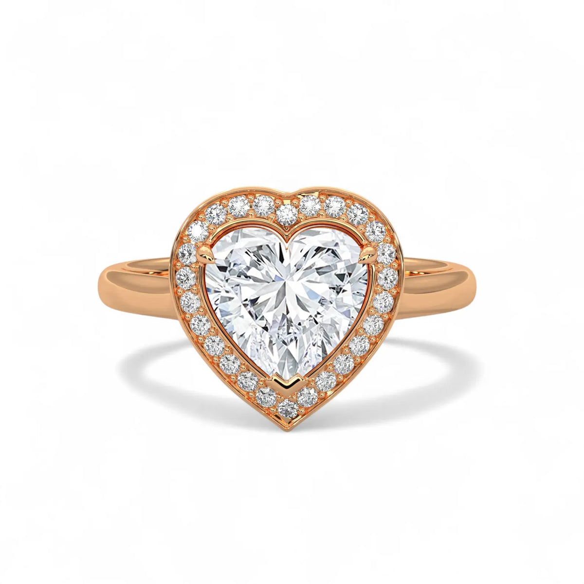 Top-down view of a 3 CT heart-cut lab grown diamond halo ring with a plain rose gold band.
