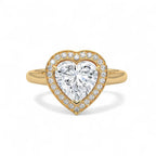 Direct top view of a 3 CT heart-cut lab diamond surrounded by a diamond halo on a yellow gold band.