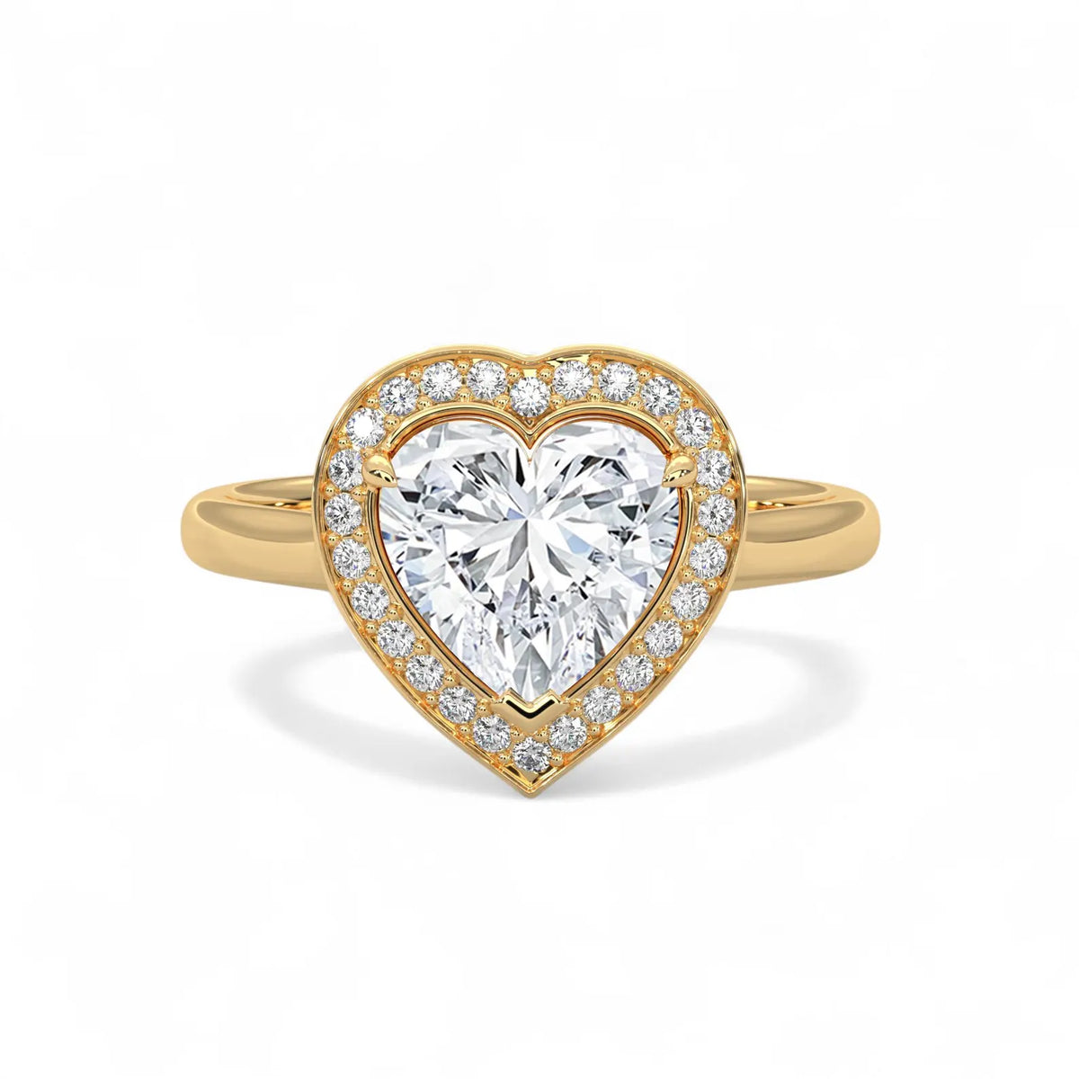 Direct top view of a 3 CT heart-cut lab diamond surrounded by a diamond halo on a yellow gold band.