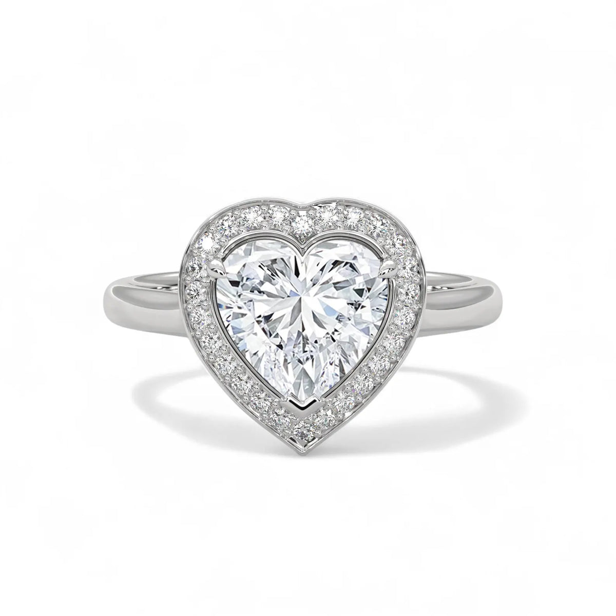 Top view of a white gold 3 carat heart cut lab-grown diamond halo engagement ring with plain shank.