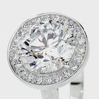 Close-up top view of a 4 CT round cut lab grown diamond halo ring in white gold.