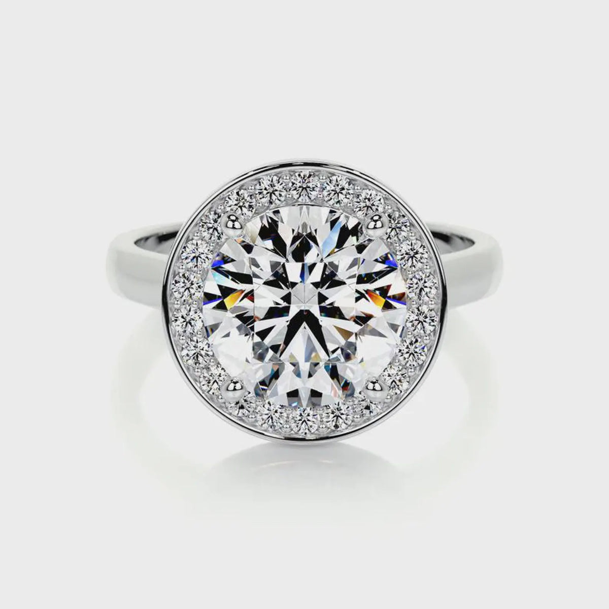 Direct top-down view of a 4 carat round lab diamond halo engagement ring with a white gold band.