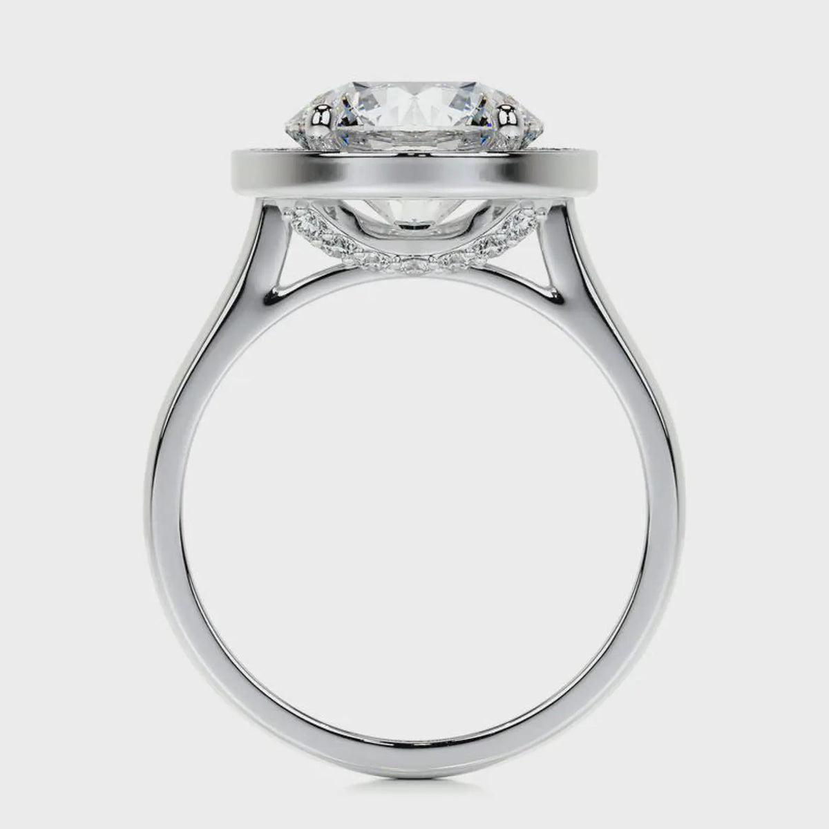 Side profile view showing cathedral bridge and hidden under-gallery pavé of a 4 CT round lab diamond ring in white gold.