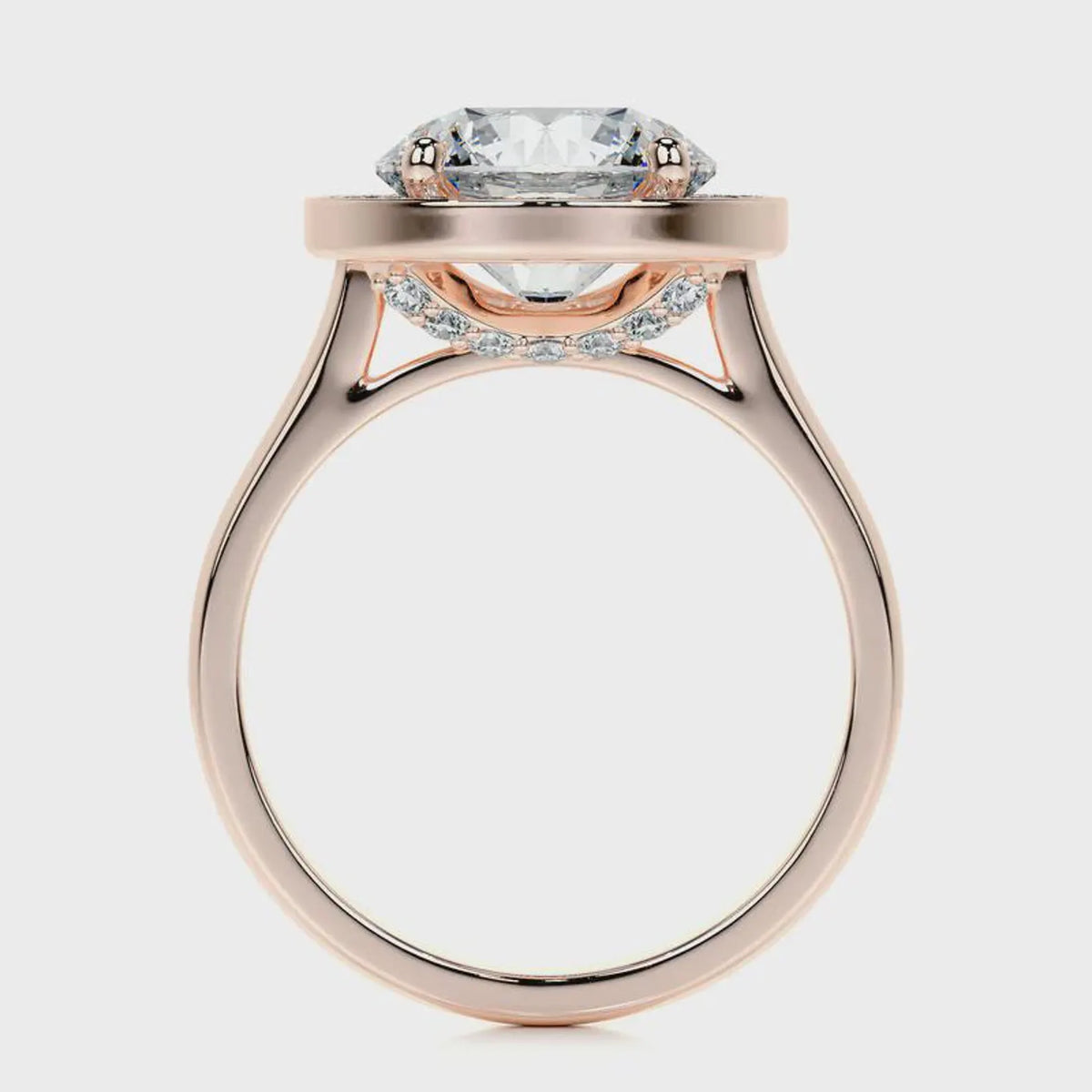 Side profile view showing cathedral setting and pavé under-gallery of a rose gold 4 CT round lab diamond ring.