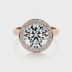 Direct top-down view of a 4 carat round cut lab diamond halo ring on a rose gold plain band.