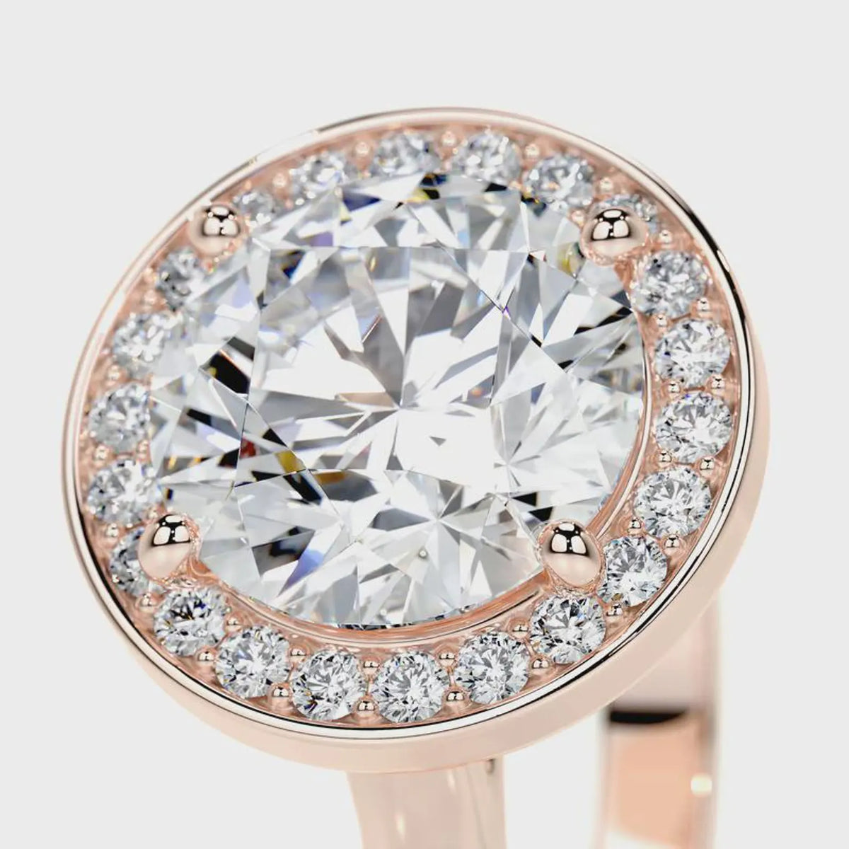 Close-up angled view of a 4 CT round cut lab grown diamond halo ring in rose gold.