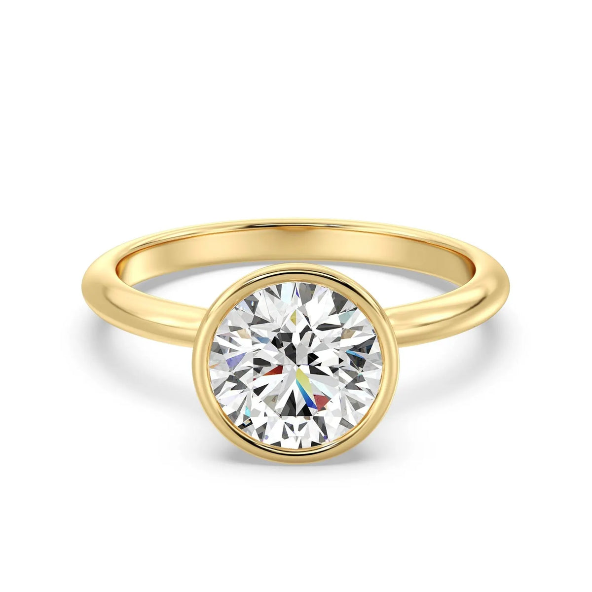 Front view of a 3 CT round cut lab grown diamond bezel engagement ring in yellow gold.