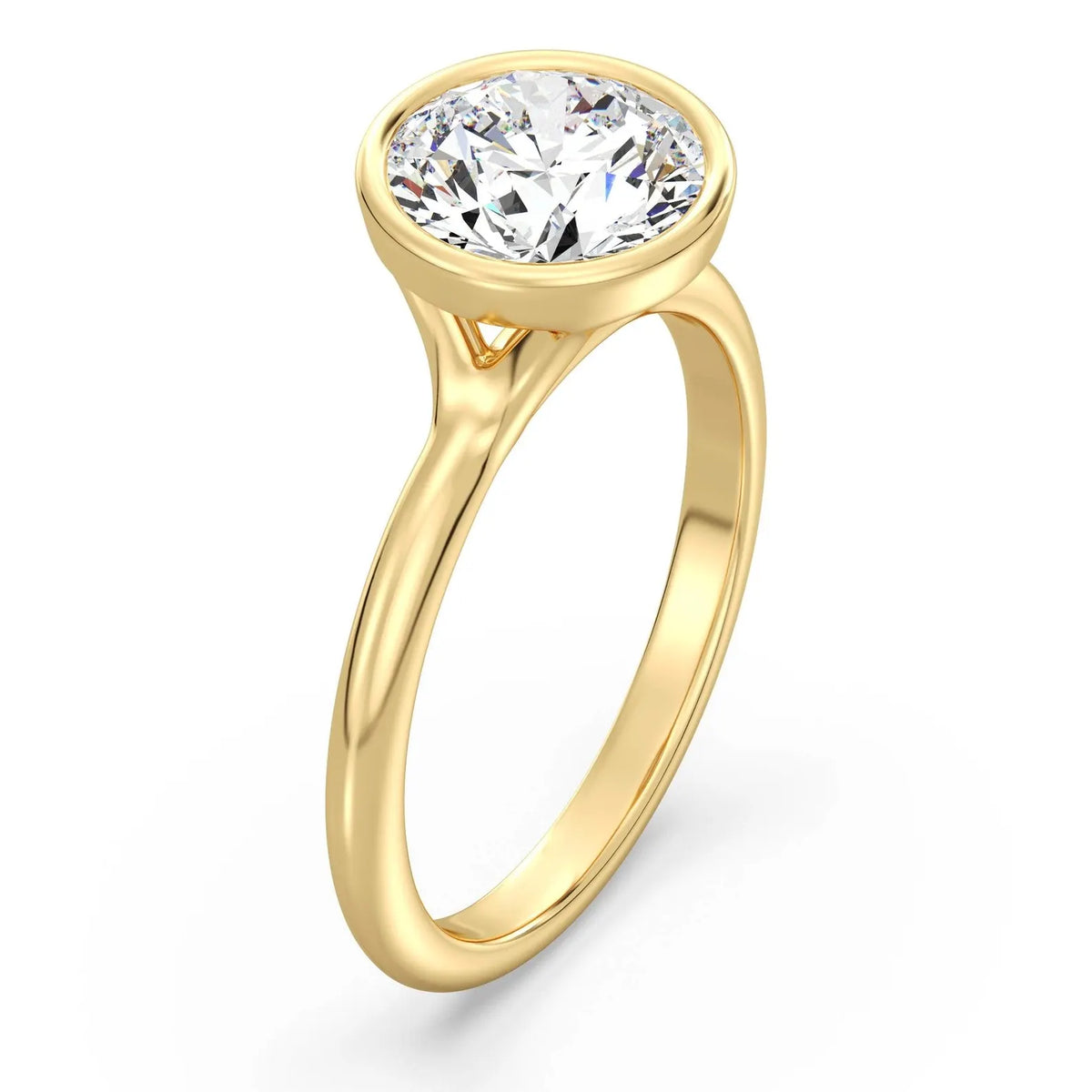 Angled perspective view of a yellow gold 3 carat round lab diamond bezel solitaire ring.