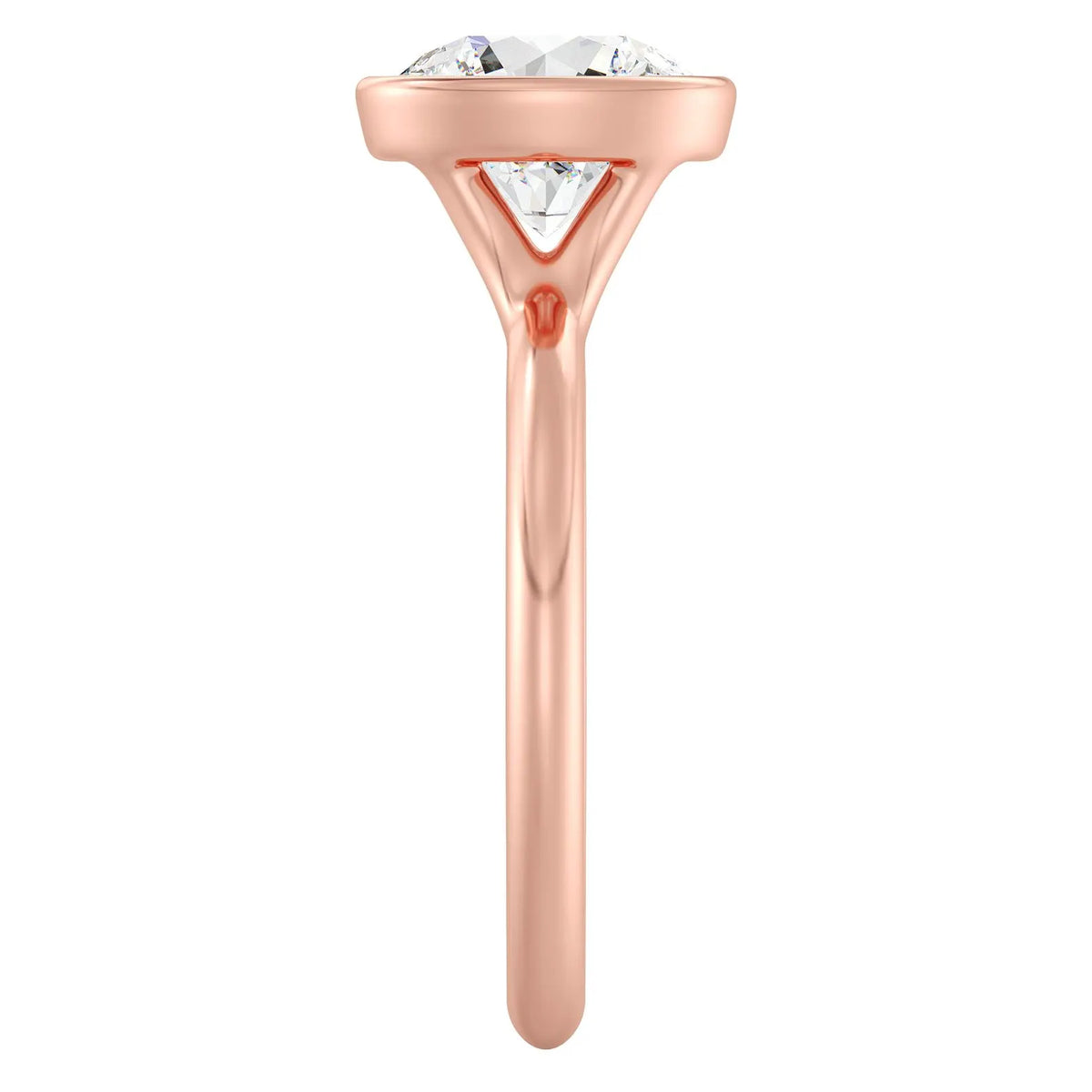Side profile view showing the open under-gallery setting of a rose gold 3 CT round lab diamond bezel ring.