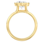 Full profile view of a yellow gold 3 CT round lab grown diamond bezel solitaire ring.