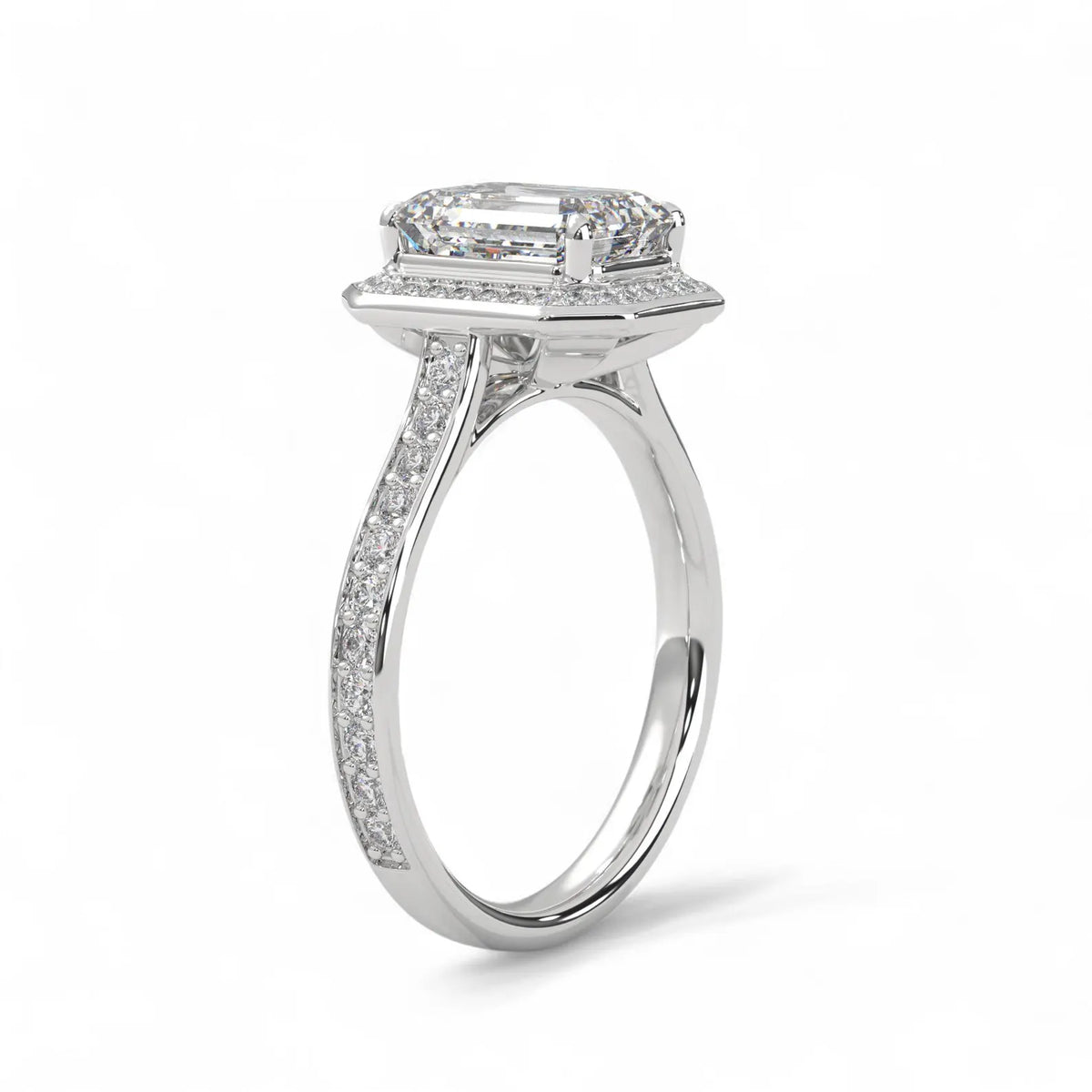 Side angle view of a white gold 4 carat emerald cut lab diamond halo engagement ring.